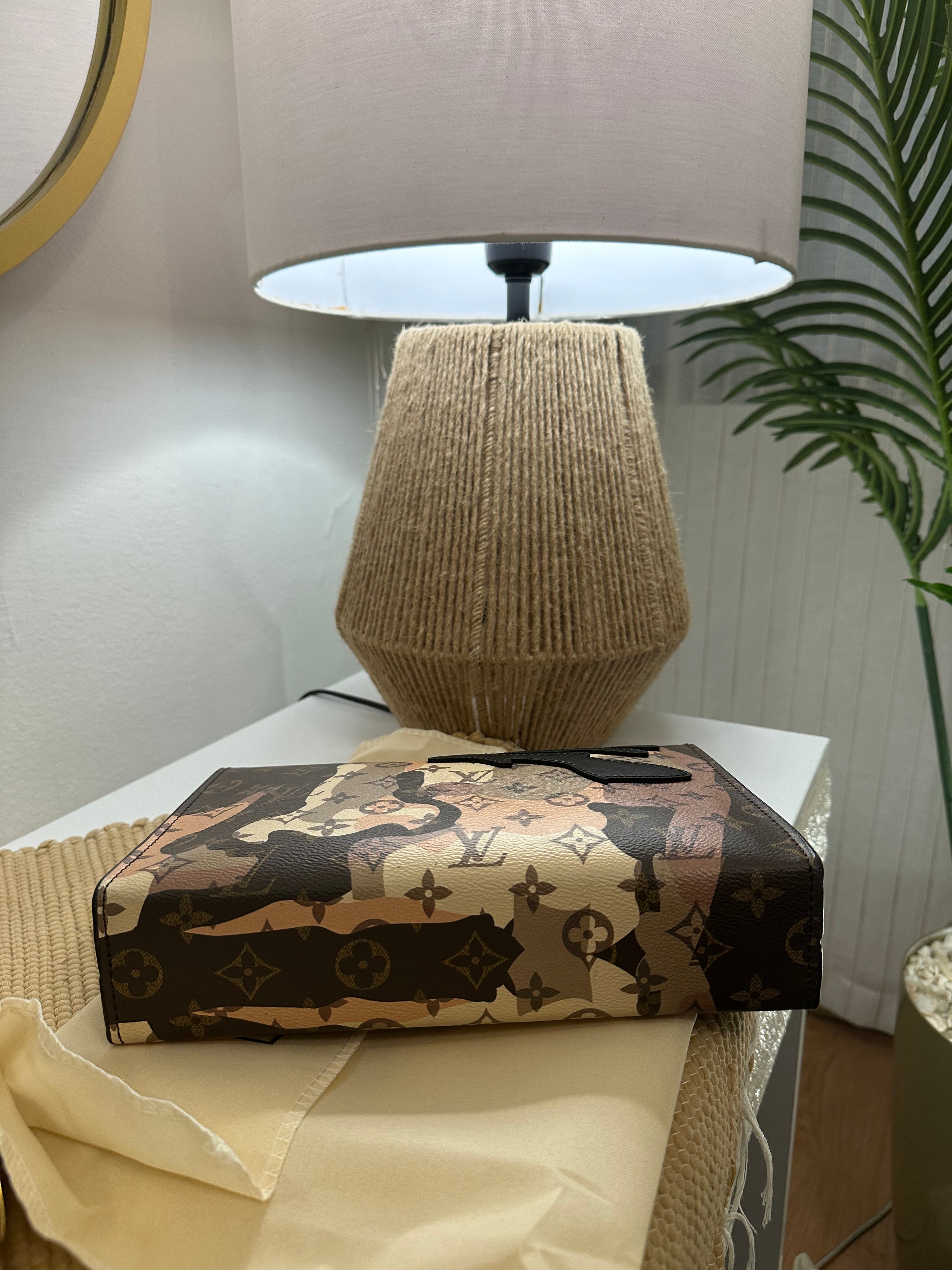 Louis Vuitton Pochette Voyage face portrait