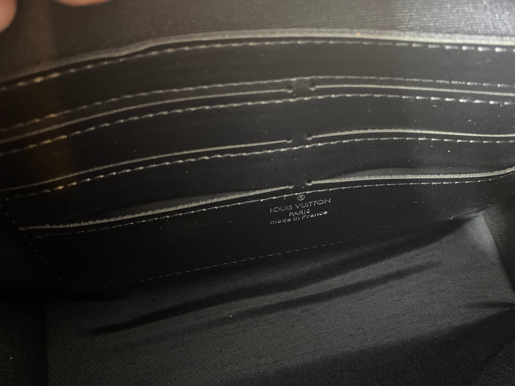 Louis Vuitton Pochette Voyage face portrait