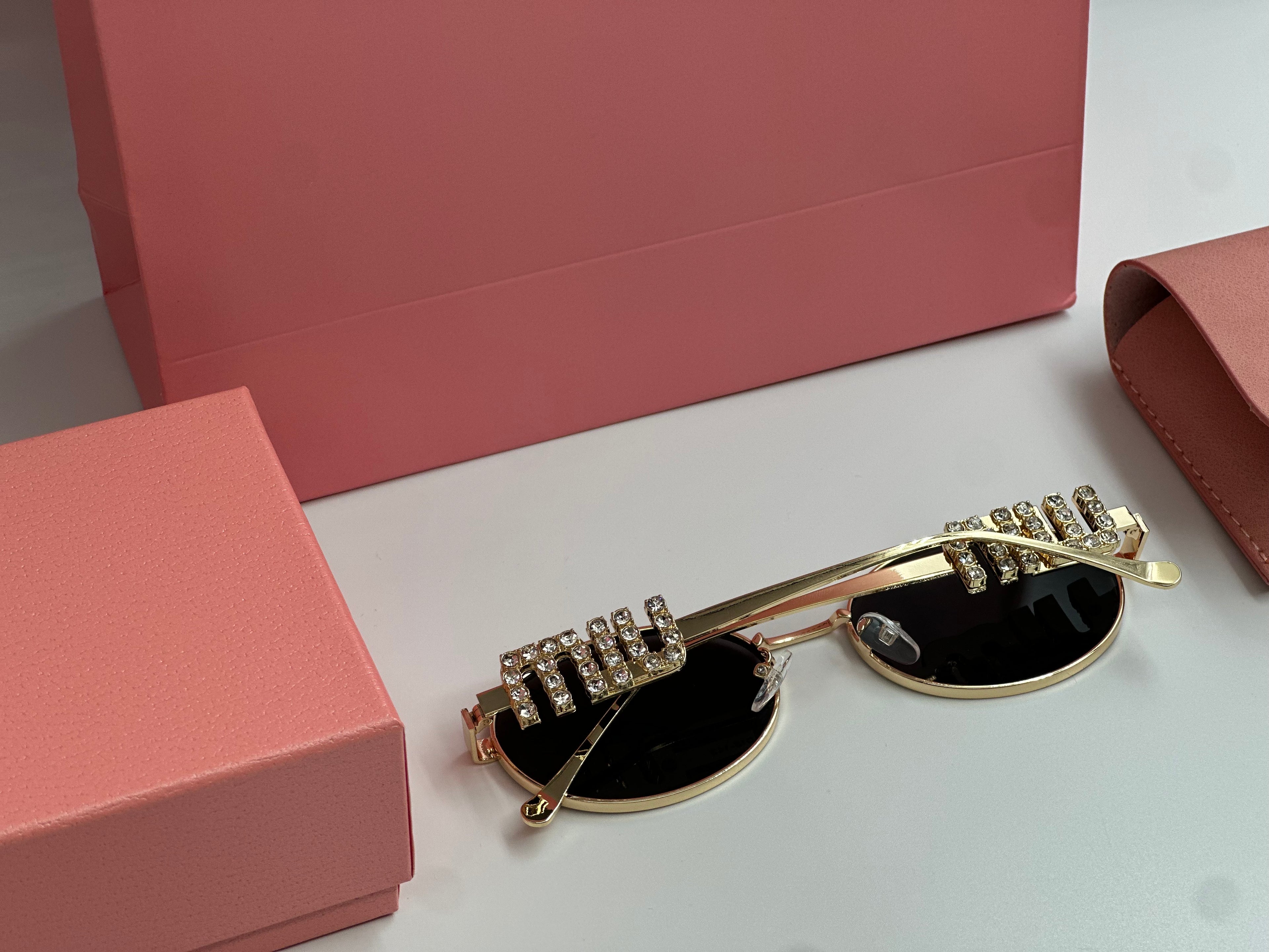 Miu Miu Crystal Oval Sunglasses